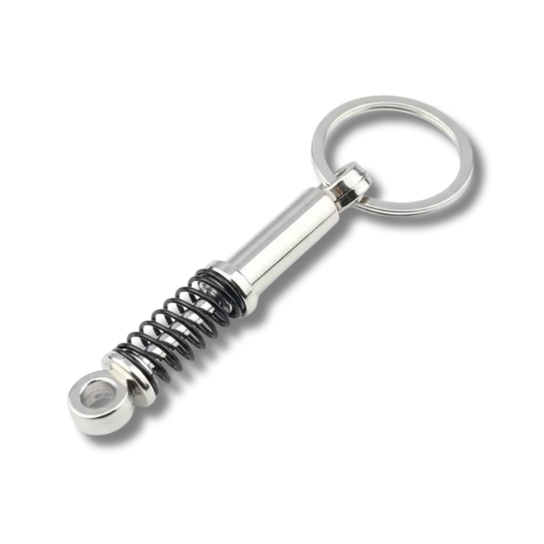 Federbein Schlüsselanhänger aus Metall, Silber/Schwarz